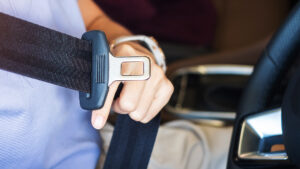 Road-safety-Stream-Woman-Driving-Hand-Fastening-Seatbelt