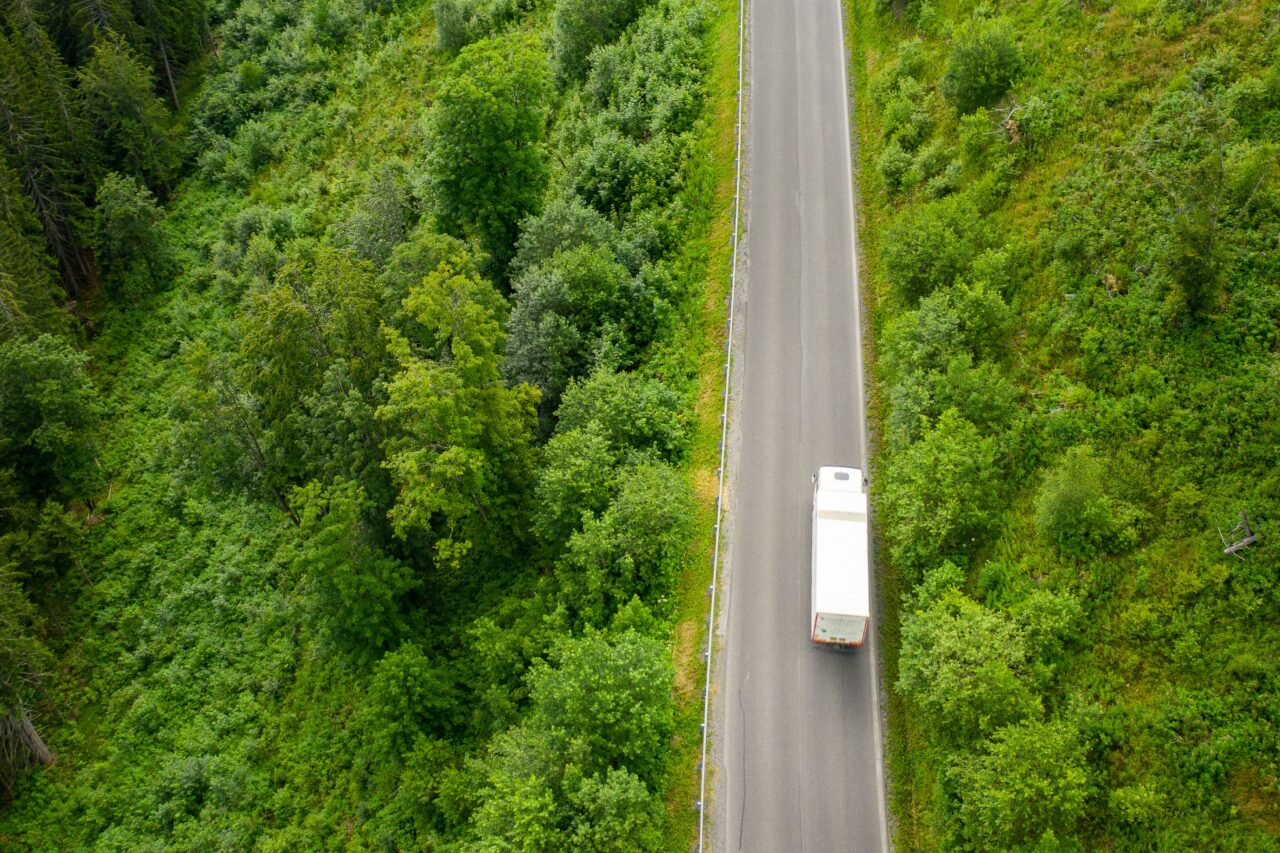 Aerial view of a HGV driving on a road